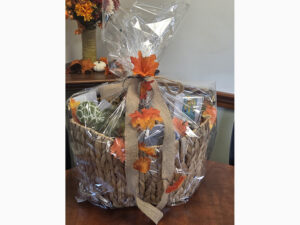 Gift basket with donations from local businesses: Anejo Mexican Bistro, Blast from the Past, Caline for Kids, Cape Cod Bagel, Colonial Filling Station, Devour Artisan Eatery, Eight Cousins Books, Ghelfi’s Candies, Island Queen, Life is Birdiful, Living EZ, Port Cargo, Real Island Co., Keep it Reel
