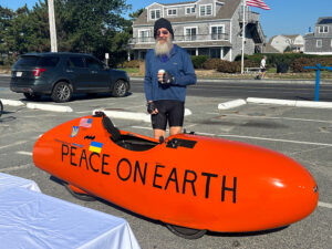 Velomobile enthusiast, David Whitmon, with his aerodynamic bicycle, Peace on Earth